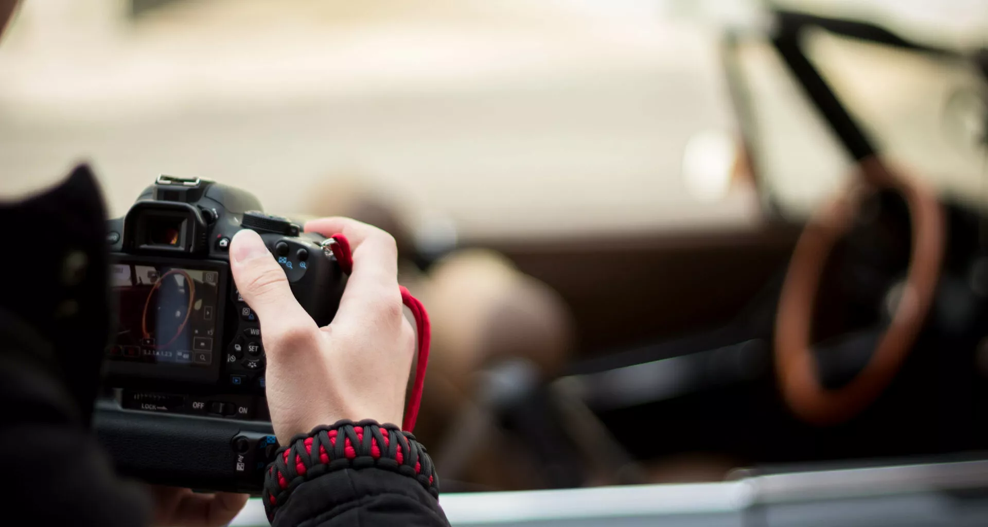 cropped hand woman photographing with camera